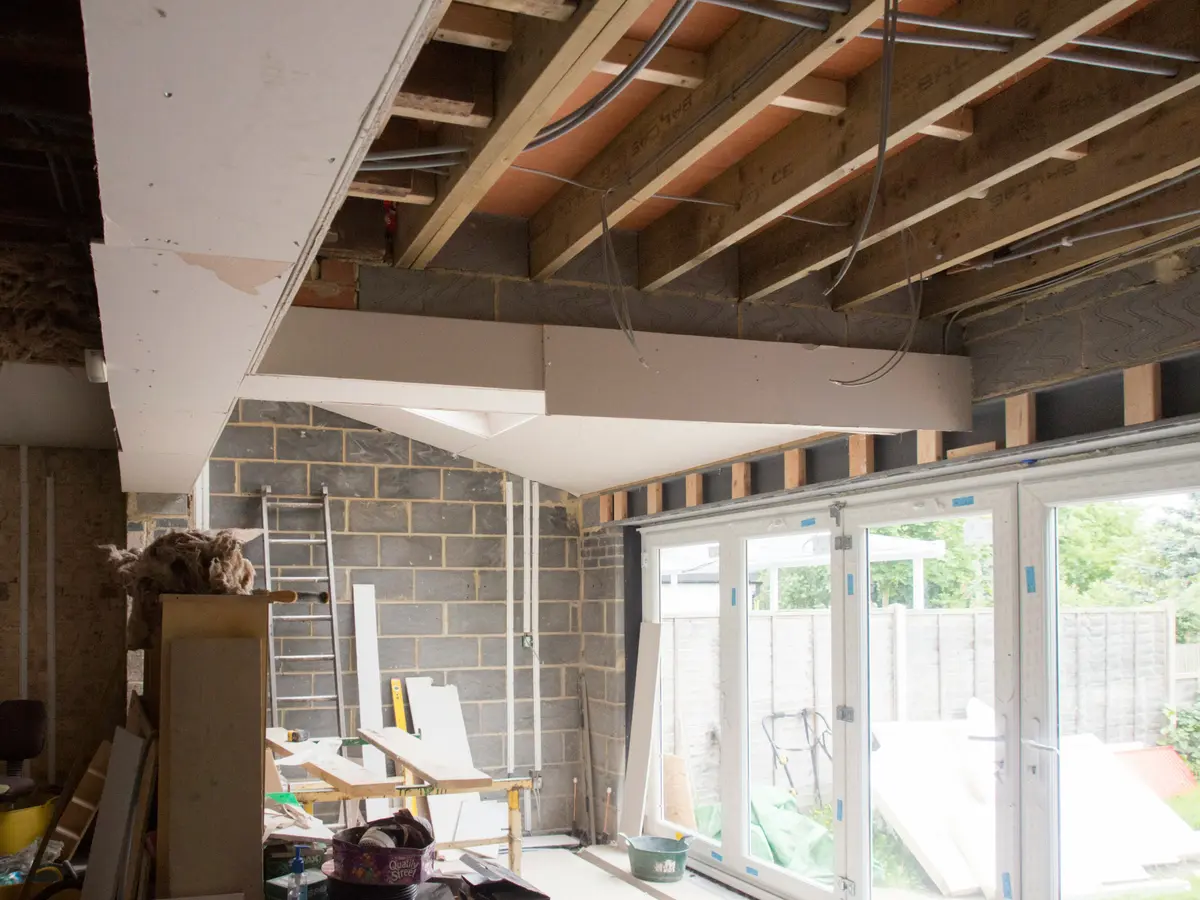 Interior construction and renovation project with exposed beams and new windows for change of use planning permission in Leicester.